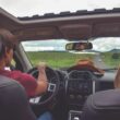 man driving straight on pathway during day time
